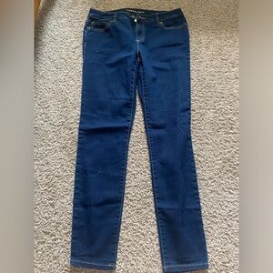 Dark Wash Straight Leg Skinny Michael Kors Denim jeans size 4 with gold accents.